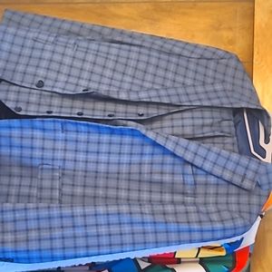 A three piece blue plaid Steave Harvey suit. Size 40w/30I pants, large vest